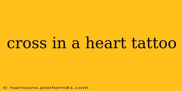 cross in a heart tattoo
