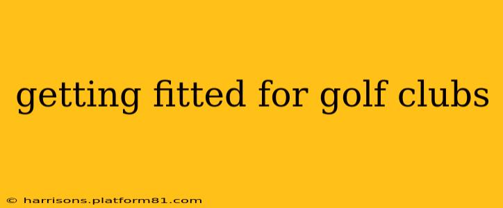 getting fitted for golf clubs