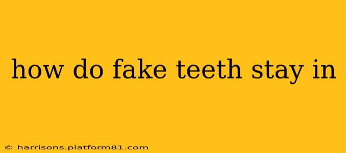 how do fake teeth stay in