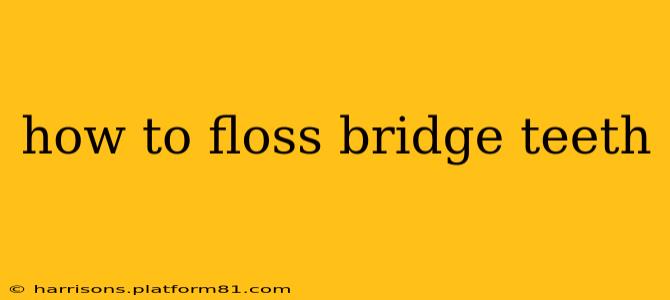 how to floss bridge teeth
