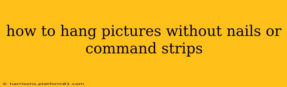 how to hang pictures without nails or command strips